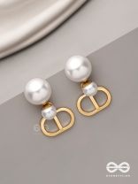 Starlit orb- dangling pearl earrings with golden spheres 