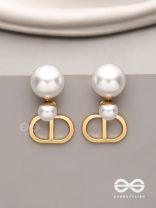 Starlit orb- dangling pearl earrings with golden spheres 