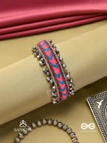 CHITRA DHARA – FLOW OF COLORS   EMBROIDERED BRACELET WITH A MIX OF COLORS AND INTRICATE THREAD WORK, ADORNED WITH GHUNGROO'S