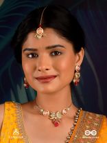 SHONAPRABHA- RADIANCE OF GOLD AND RED- HANDCRAFTED KUNDANMAANGTIKA  WITH GOLDEN MOONS AND RED BEADS