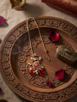 TRADITIONAL RED ENAMELLED POLKI MAANGTIKA WITH LUSTROUS BEADS AND PEARLS