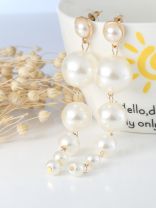 Elegance is a deadly weapon- white pearls statement earrings