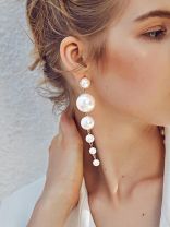 Elegance is a deadly weapon- white pearls statement earrings