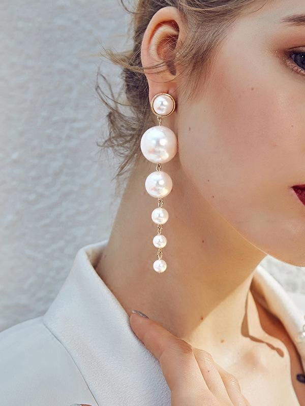 Elegance is a deadly weapon- white pearls statement earrings