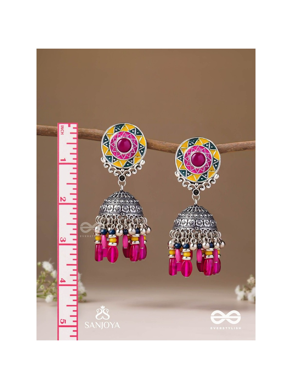 Suryaruchi-Sun's Radiance-Lavish pink earrings enamelled with a sun motif and oxidized jhumka adorned with beads and ghunghroos