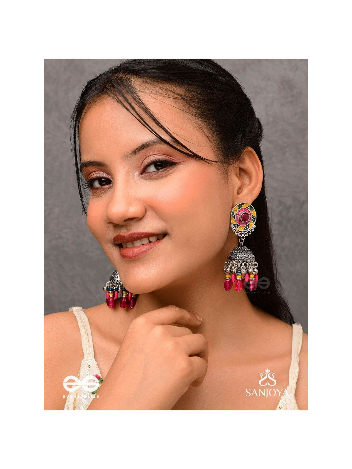 Suryaruchi-Sun's Radiance-Lavish pink earrings enamelled with a sun motif and oxidized jhumka adorned with beads and ghunghroos