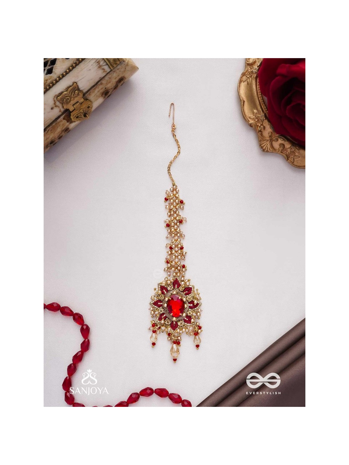 Kumudinikunda-Delicate lotus-Embroidered hair accessory with a red stone & golden embellishments