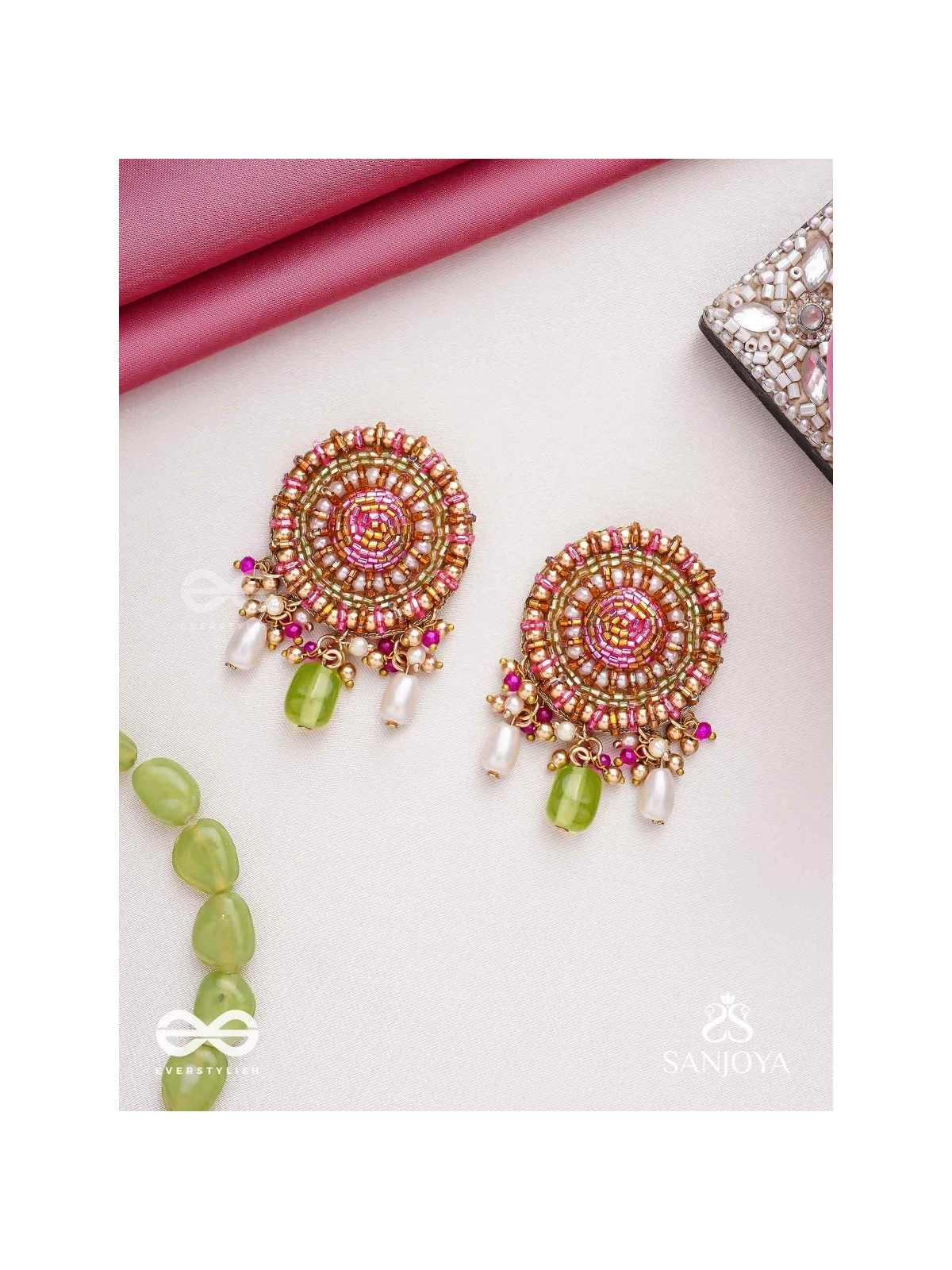 Māṇikyamāṇḍala- Gem Mandala-Circular motifs embellished with pink and golden accents, beads, and stones