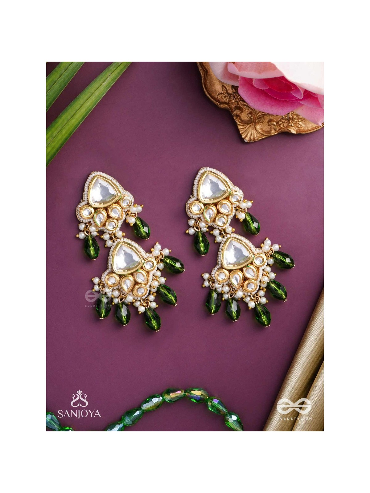 Kundalāṅgī-Kundan Elegance- Traditional pearl and Kundan earrings adorned with beads, stones, and green danglers for a regal touch.