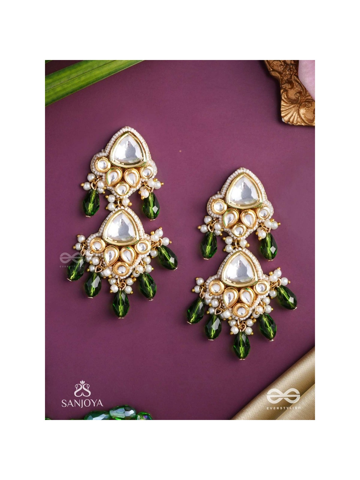 Kundalāṅgī-Kundan Elegance- Traditional pearl and Kundan earrings adorned with beads, stones, and green danglers for a regal touch.