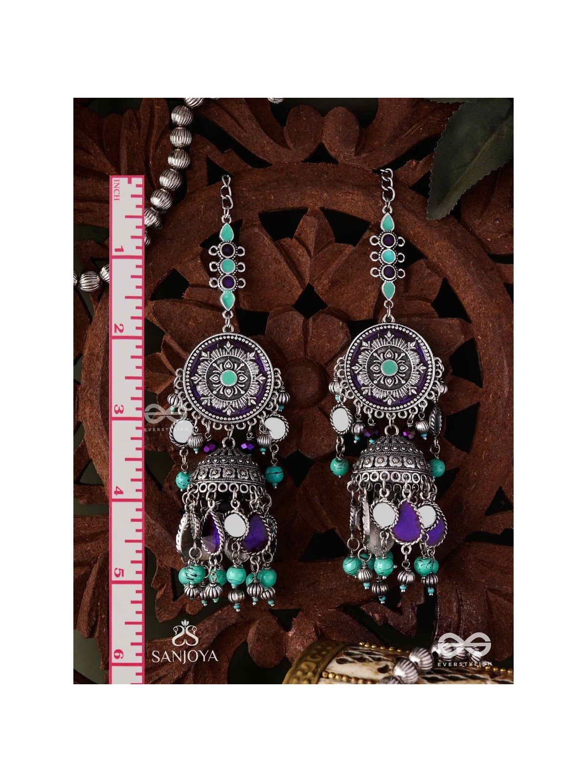RATNA TILAKA-JEWEL ADORNMENT- EARRINGS ENAMELLED IN SHADES OF BLUE AND BLACK, ACCENTED WITH GHUNGROO BEADS AND OXIDIZED JHUMKI
