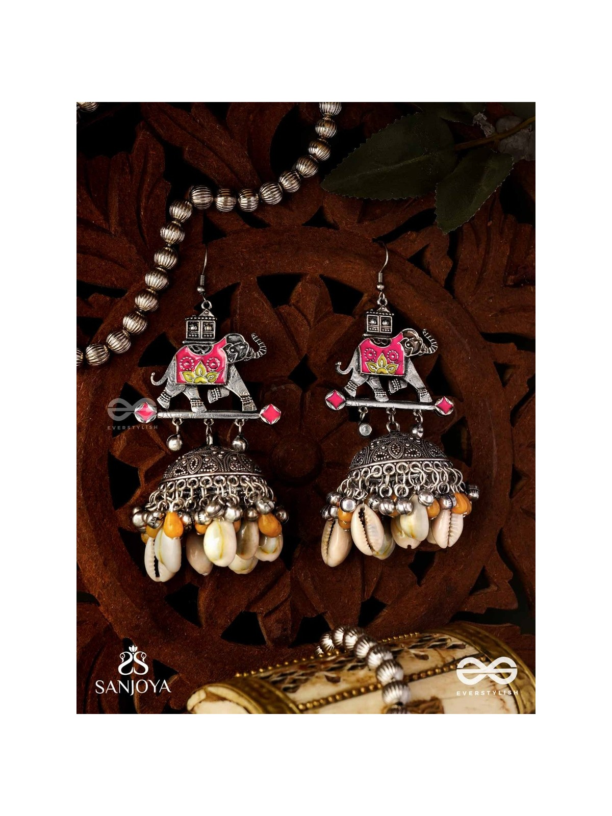 GAJASANKHA KARṆIKA- ELEPHANT-SHELL EARRINGS- OXIDIZED EARRINGS FEATURING AN ELEGANT MOTIF, DELICATE GHUNGHROO'S, AND COWRIE SHELLS