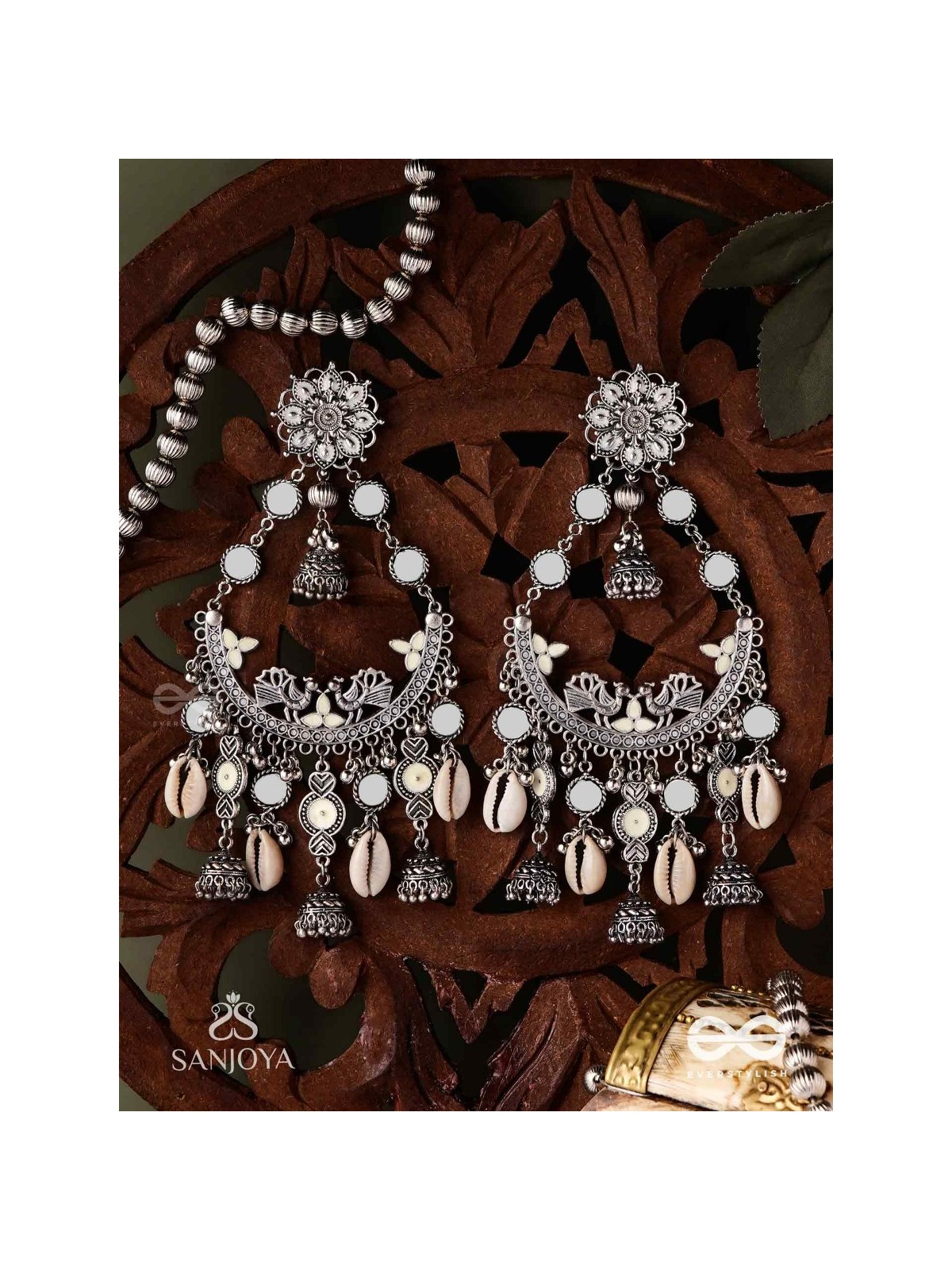 CHANDRAMAYURA- MOON-PEACOCK EARRINGS- OXIDIZED CHAANDBAALI EARRINGS, ADORNED WITH MIRRORS, GHUNGHROOS, COWRIE SHELLS, AND DANGLING JHUMKA