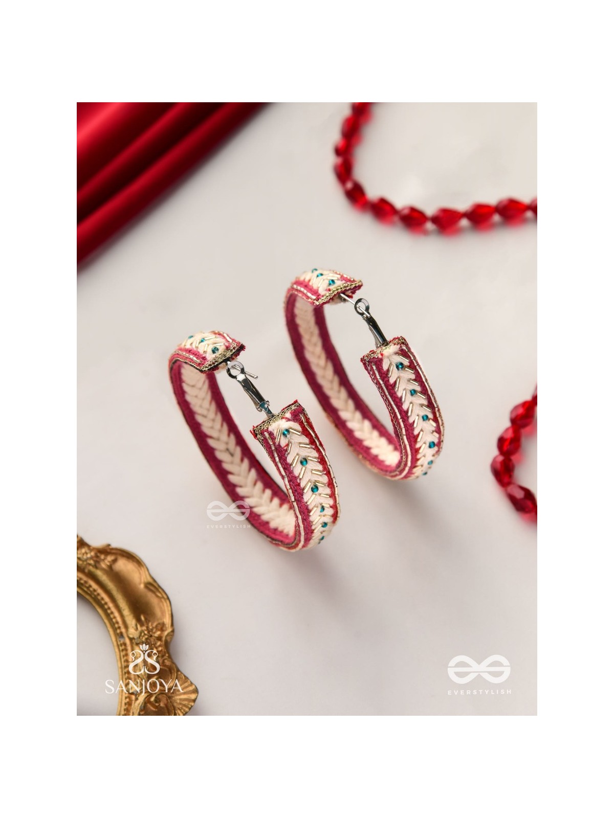 Vasantiruchi- Spring Charm- Embroidered earrings with red and white threads, decorated with beads and gold accents