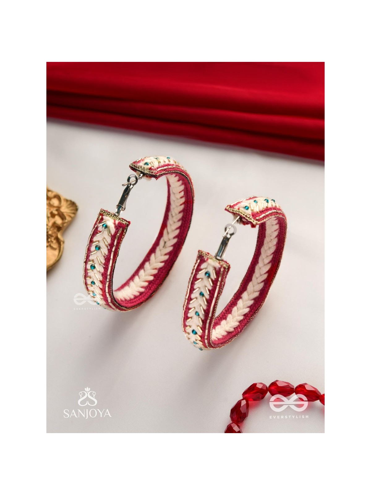 Vasantiruchi- Spring Charm- Embroidered earrings with red and white threads, decorated with beads and gold accents