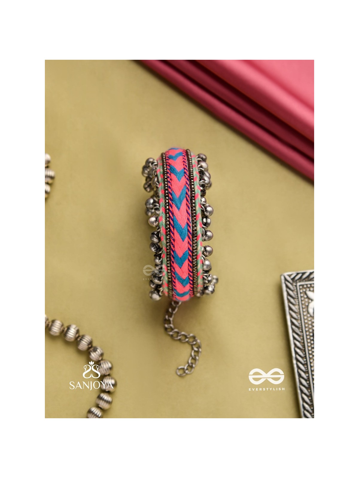 CHITRA DHARA – FLOW OF COLORS   EMBROIDERED BRACELET WITH A MIX OF COLORS AND INTRICATE THREAD WORK, ADORNED WITH GHUNGROO'S