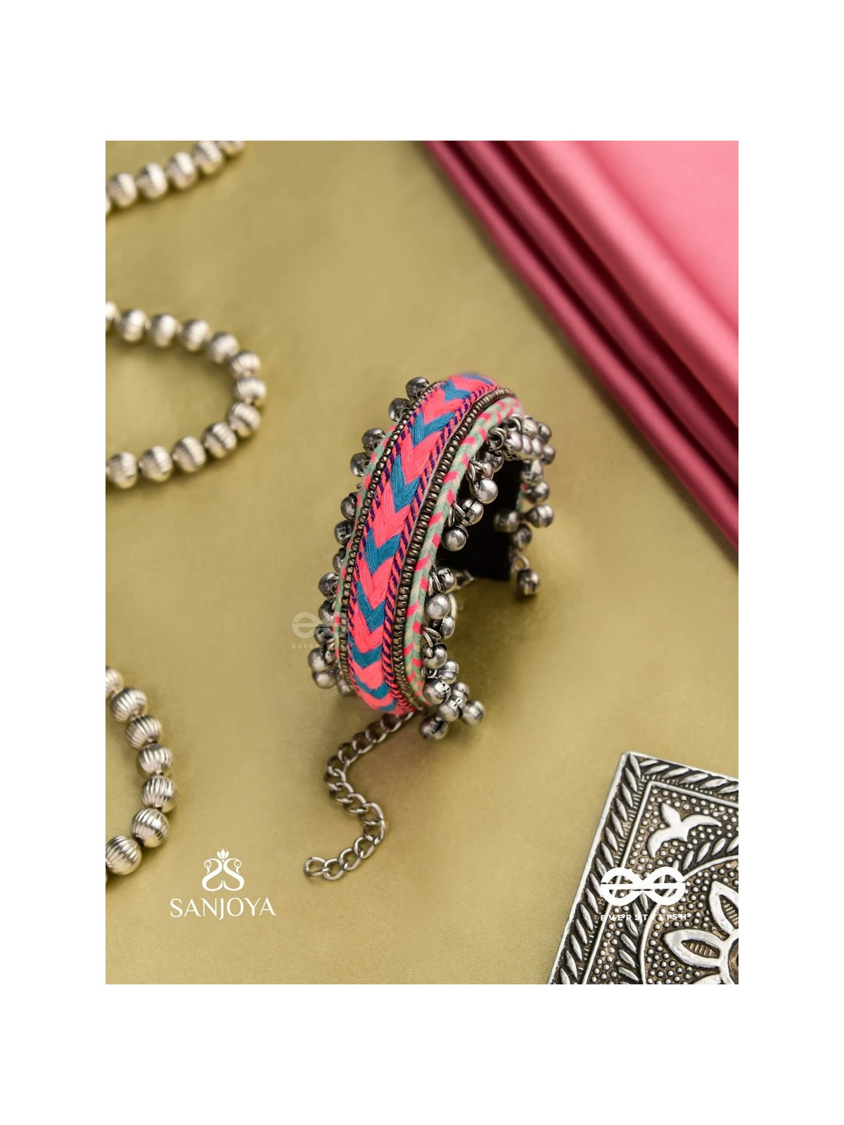 CHITRA DHARA – FLOW OF COLORS   EMBROIDERED BRACELET WITH A MIX OF COLORS AND INTRICATE THREAD WORK, ADORNED WITH GHUNGROO'S