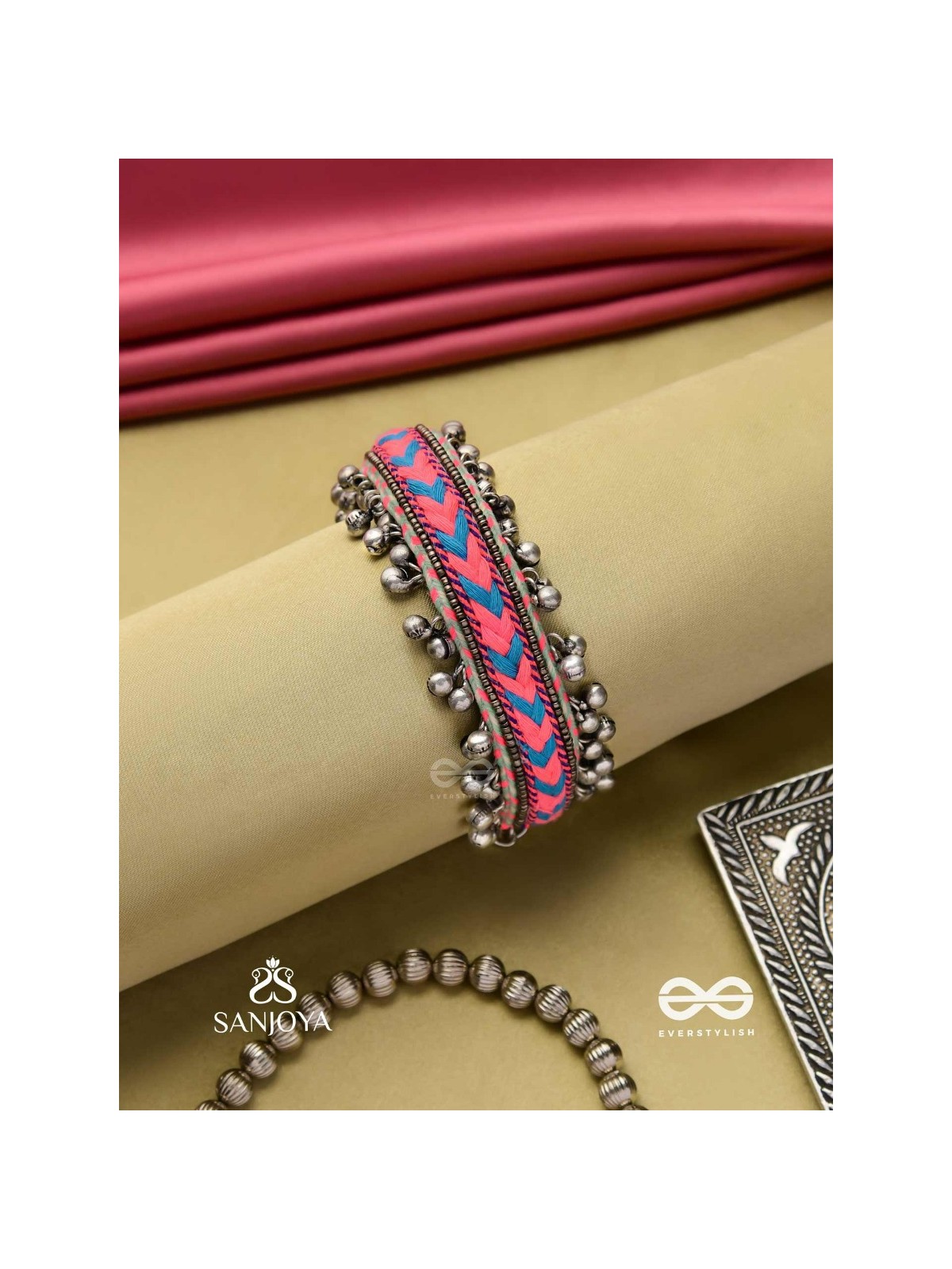 CHITRA DHARA – FLOW OF COLORS   EMBROIDERED BRACELET WITH A MIX OF COLORS AND INTRICATE THREAD WORK, ADORNED WITH GHUNGROO'S
