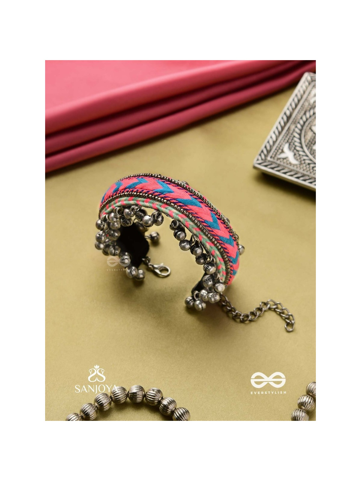 CHITRA DHARA – FLOW OF COLORS   EMBROIDERED BRACELET WITH A MIX OF COLORS AND INTRICATE THREAD WORK, ADORNED WITH GHUNGROO'S