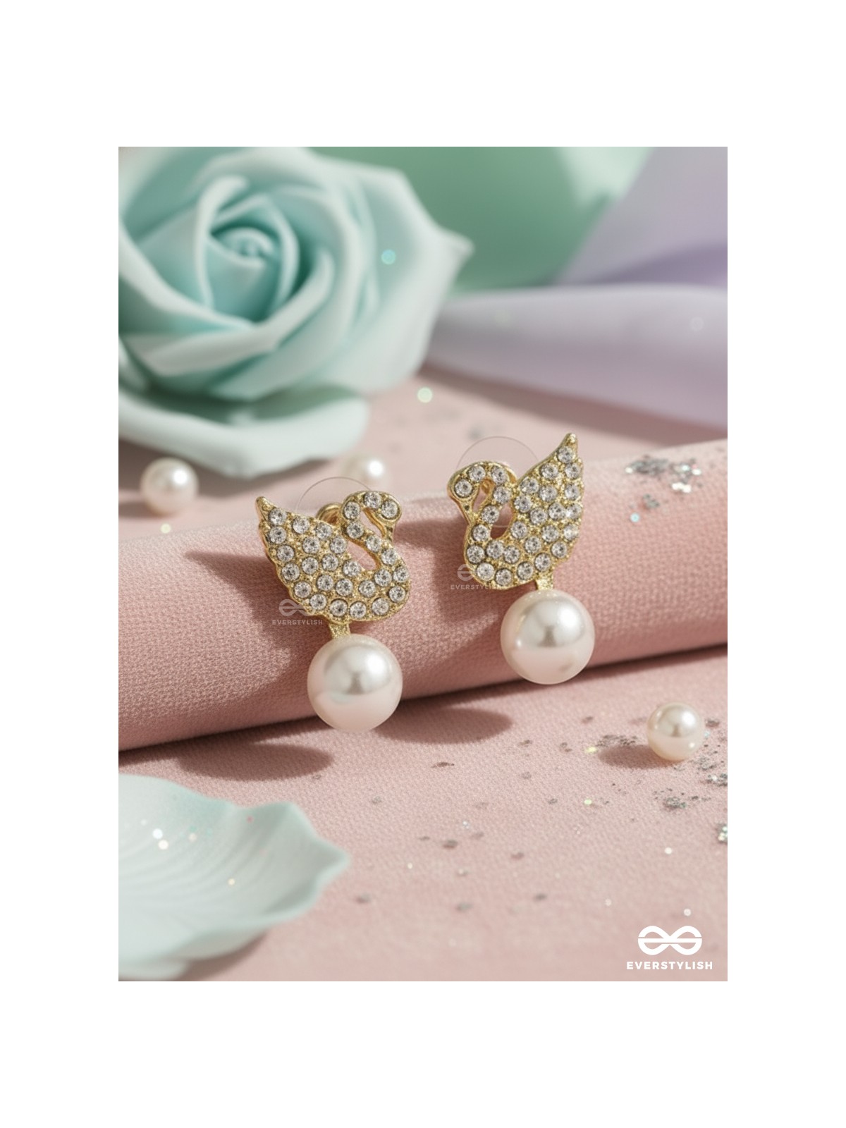 CELESTE SWAN – RADIANT WINGED STUDS WITH A CLASSIC PEARL DROP