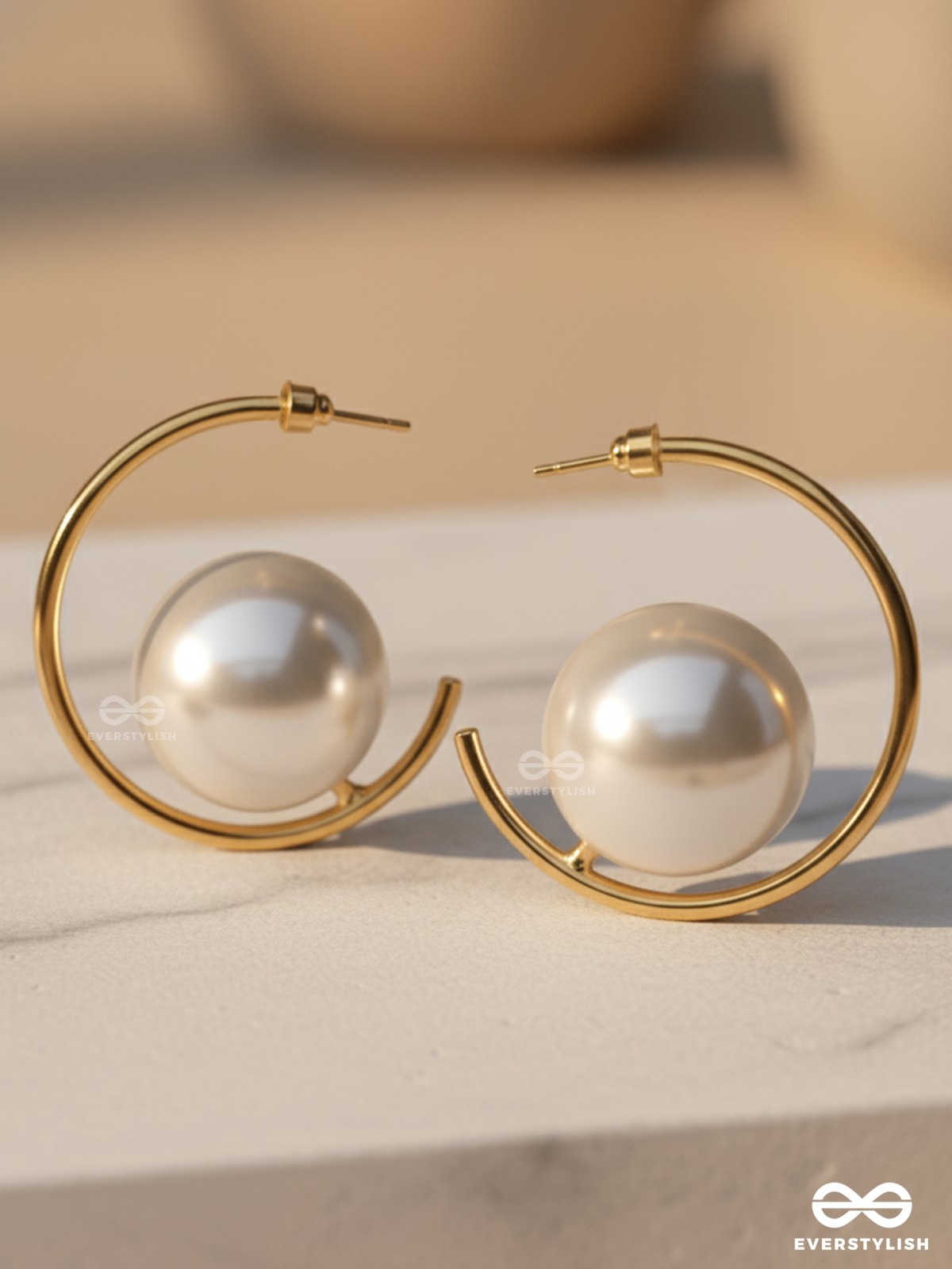LUNAR LOOP – MODERN PEARL EARRINGS IN A GOLD HOOP DESIGN
